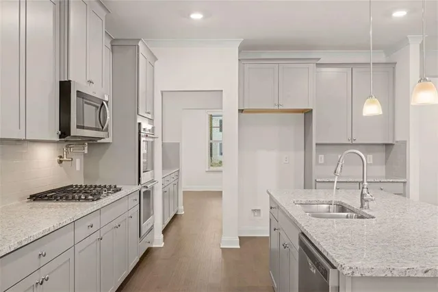 a kitchen with sink cabinets and stove