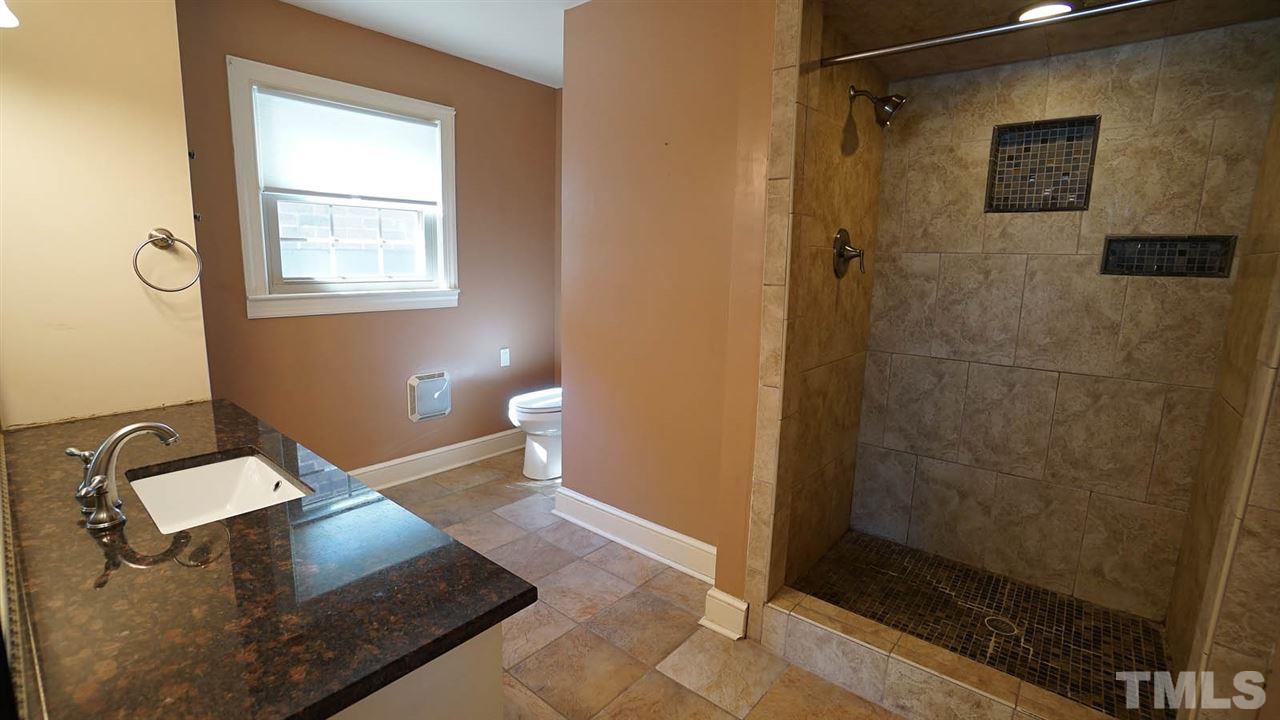 1421 Lynn Road Raleigh, NC 27612 - Photo 16 of 30 Remodeled in 2013-granite counters, tile floors, walk in shower.