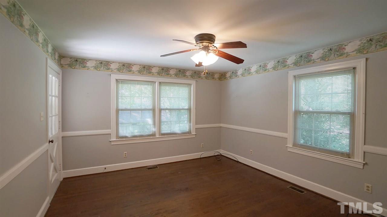 1421 Lynn Road Raleigh, NC 27612 - Photo 21 of 30 Main level guest bedroom with full bathroom, and private access to deck