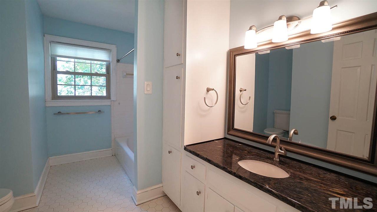 1421 Lynn Road Raleigh, NC 27612 - Photo 23 of 30 Original tile floor, granite counters