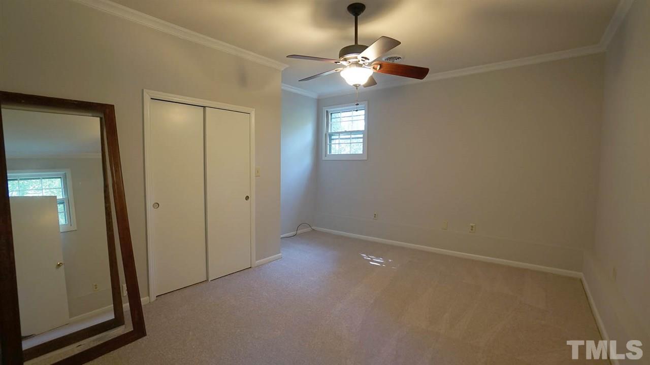 1421 Lynn Road Raleigh, NC 27612 - Photo 30 of 30 Large bedroom with brand new carpet and paint, nice size closet.