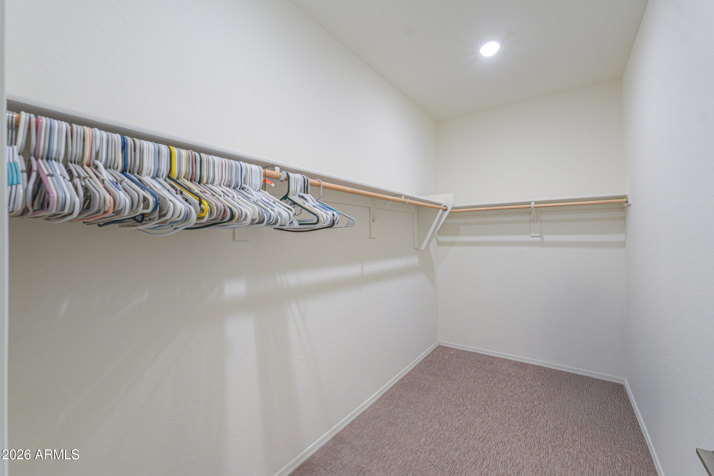 42085 West Cribbage Road Maricopa, AZ 85138 - Photo 27 of 35 a view of walk in closet with clothes