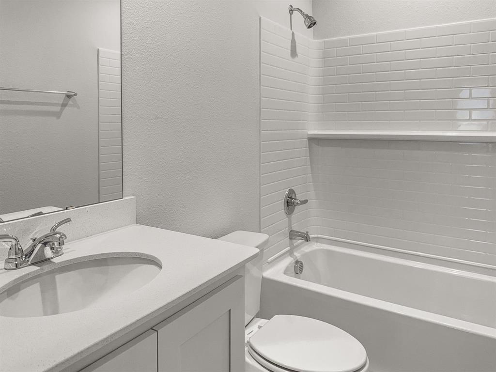 1908 Iris Road Melissa, TX 75454 - Photo 23 of 30 a bathroom with a sink toilet and bathtub