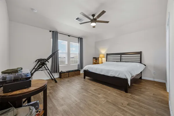 a store room with lots of clutter and furniture