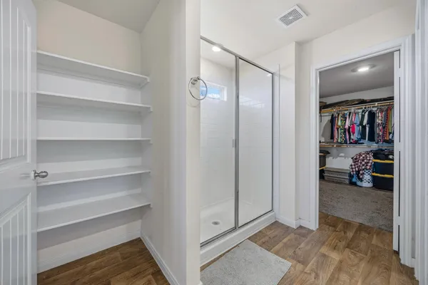 a bed room with a bed and a chandelier