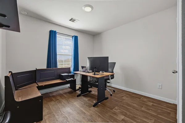 a view of a livingroom with walk in closet and bedroom view