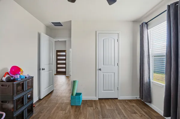 a bedroom that has a bed and a window