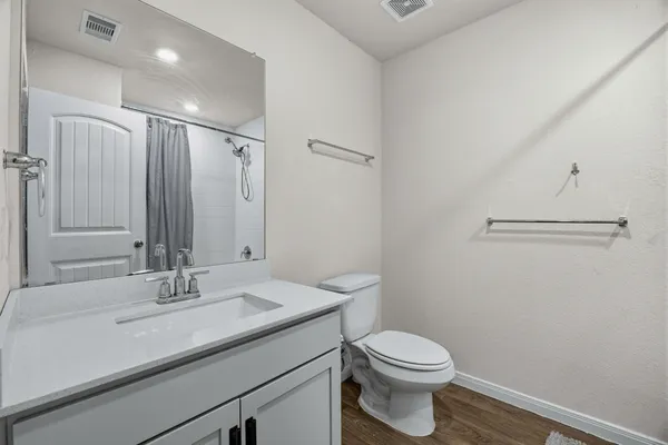 a bedroom with baby bed and dresser