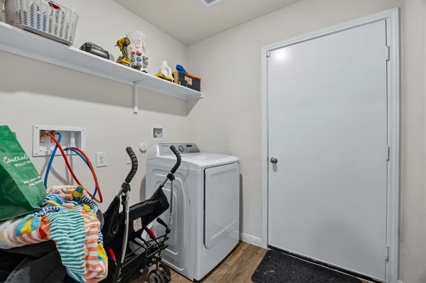a view of a room with wooden floor and closet