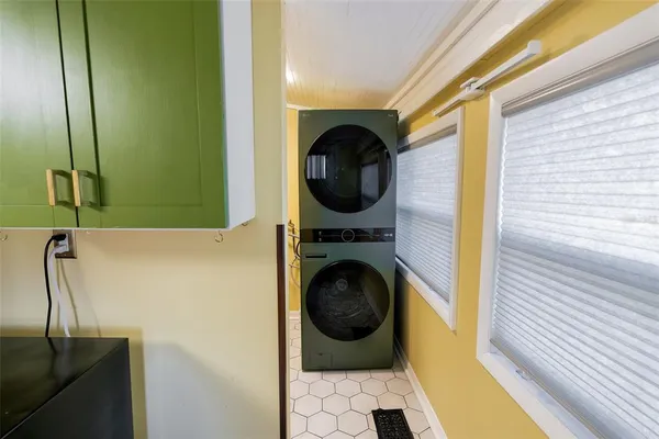 a view of a hallway with washer and dryer