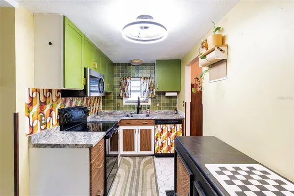 a kitchen with a stove and a refrigerator