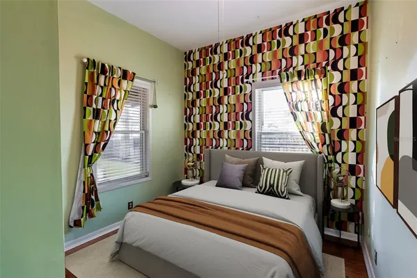 a bedroom with a bed and a book shelf