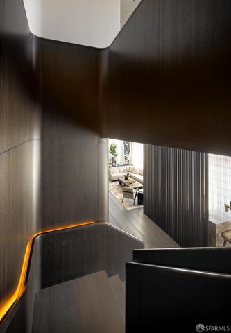 a kitchen with a sink and dishwasher next to a window