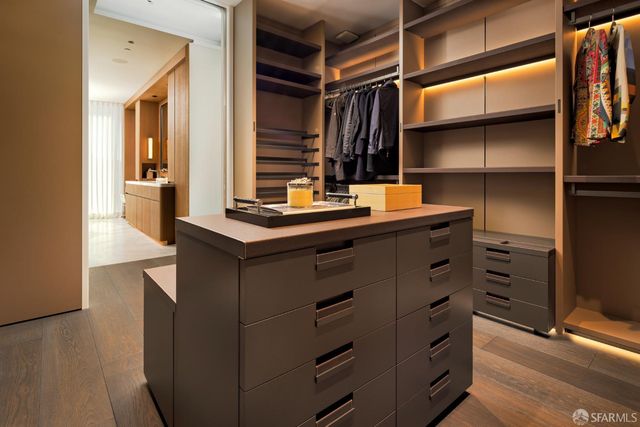 a room with cabinets and wooden floor