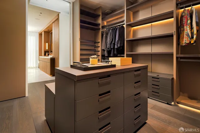 a room with cabinets and wooden floor