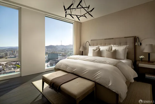 a bed sitting in a bedroom next to a window