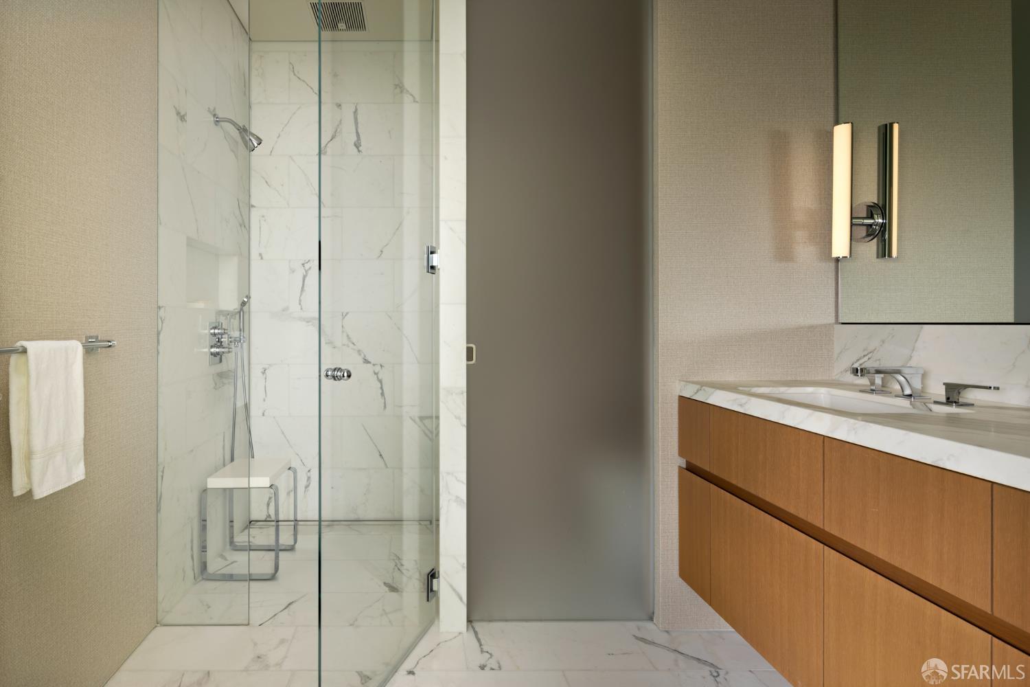 2121 Webster Street, Unit GPH1 San Francisco, CA 94115 - Photo 23 of 34 a bathroom with a granite countertop sink two mirror and shower