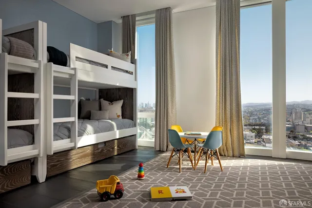 a dining room with furniture and a floor to ceiling window