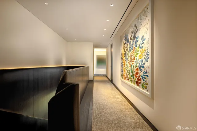 a view of entryway with wooden floor and stairs