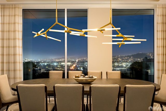 a view of a dining room with furniture window and outside view