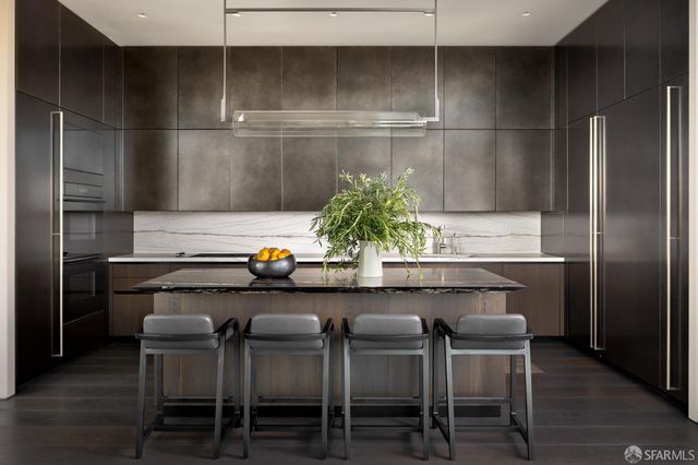 a kitchen with a table and chairs in it