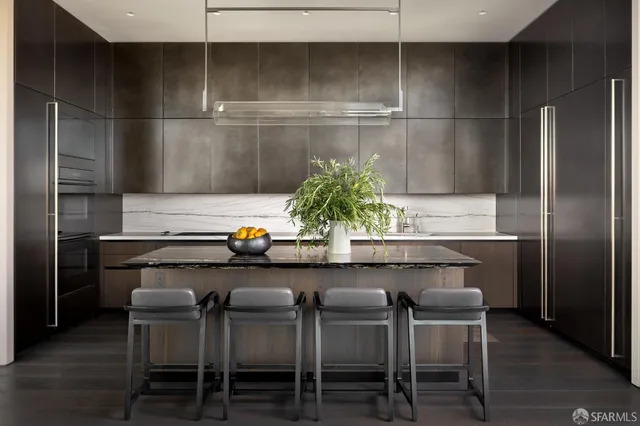 a kitchen with a table and chairs in it