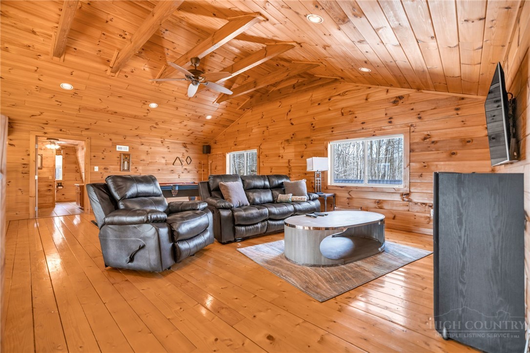 7994 3 Top Road Todd, NC 28684 - Photo 24 of 50 a living room with patio furniture and a fireplace
