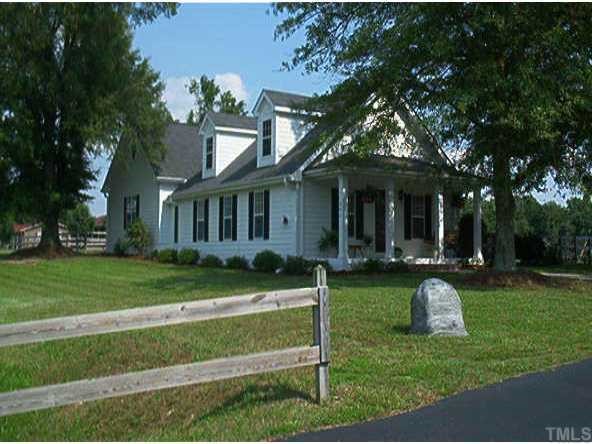 291 Pilot-Riley Road Zebulon, NC 27597 - Photo 1 of 1 a front view of a house with a yard table and chairs