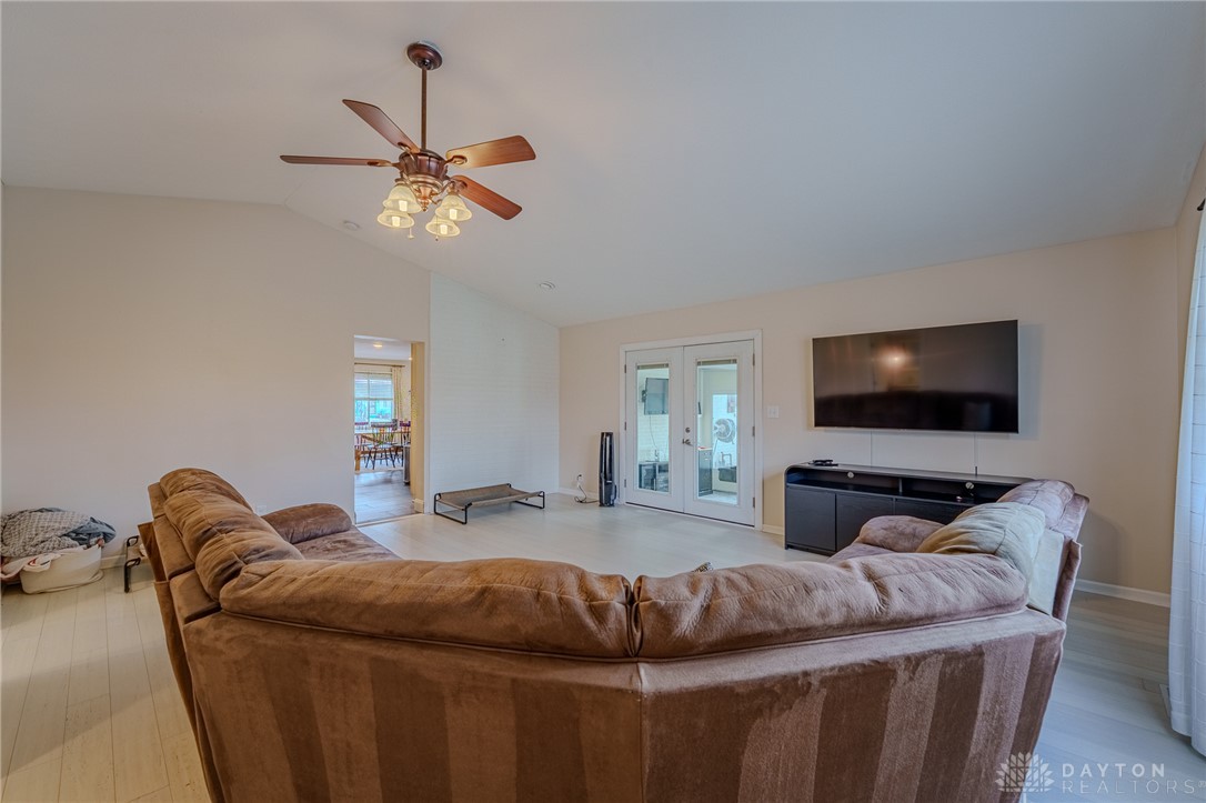 305 South Vandemark Road Sidney, OH 45365 - Photo 22 of 32 This bright living space features a vaulted ceiling and direct access to outdoor areas.