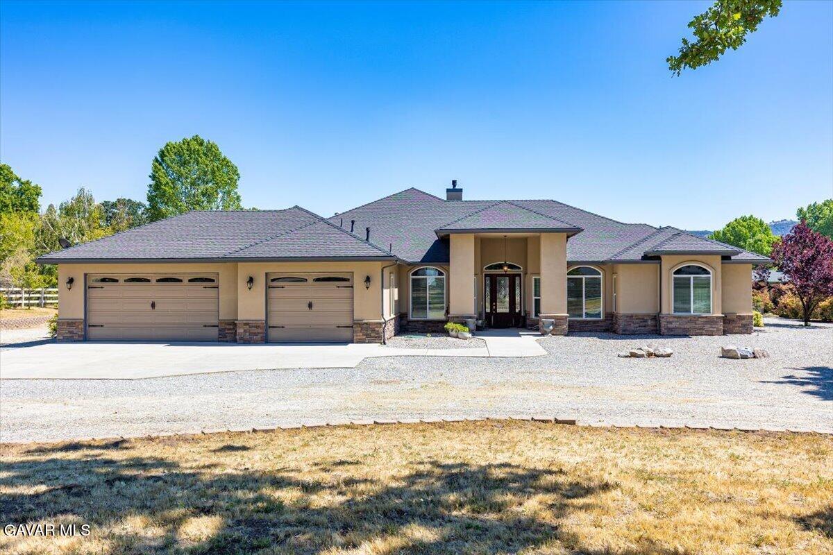 23840 Martingale Way Tehachapi, CA 93561 - Photo 1 of 63 a front view of a house with a yard