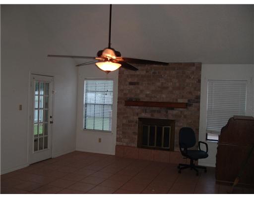 7313 Elm Hollow Drive Corpus Christi, TX 78413 - Photo 2 of 3 a living room with furniture and a fireplace