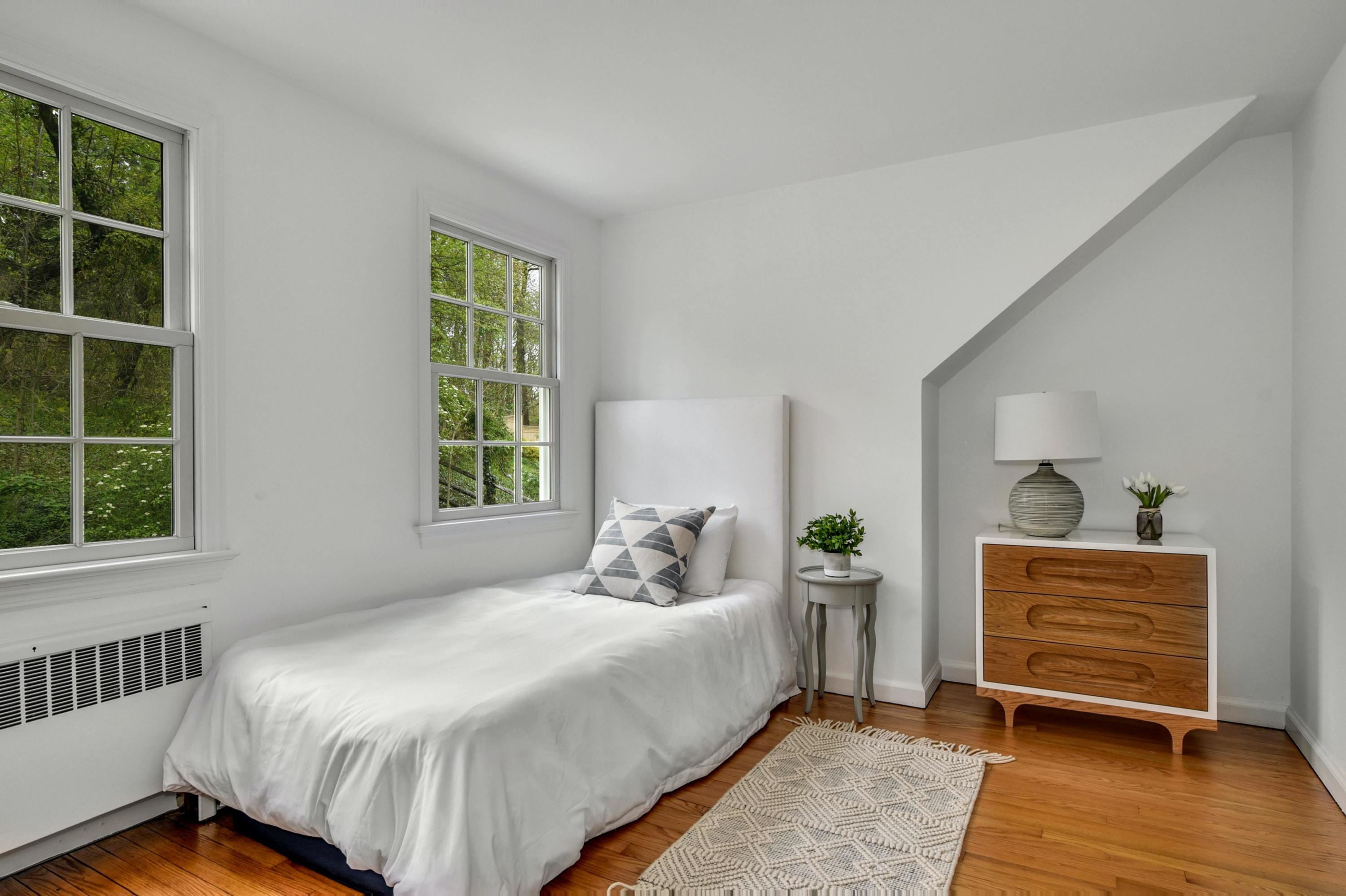 212 Tokeneke Road Darien, CT 06820 - Photo 13 of 23 a bedroom with a bed and a window