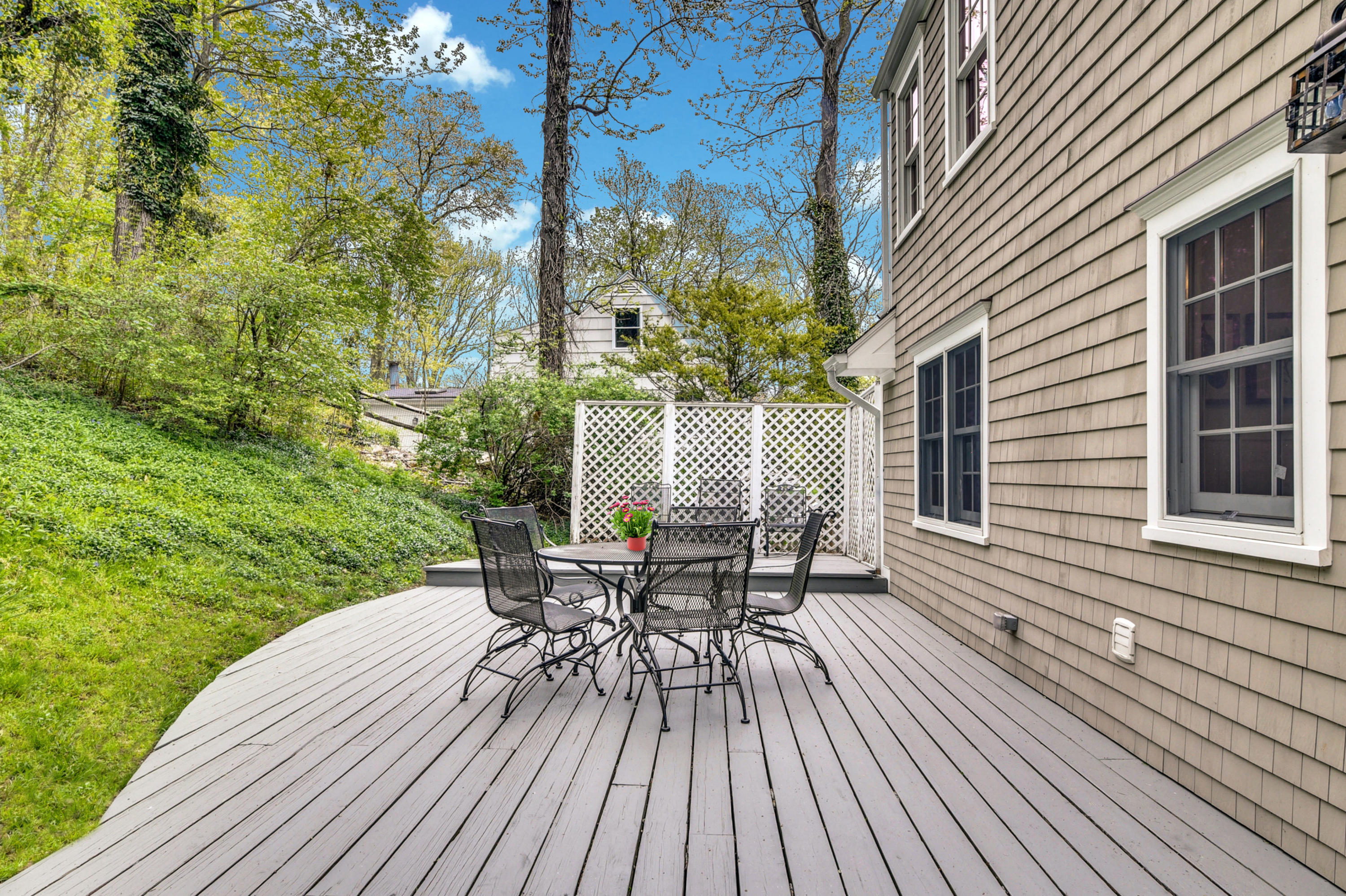 212 Tokeneke Road Darien, CT 06820 - Photo 18 of 23 a view of a house with backyard and sitting area