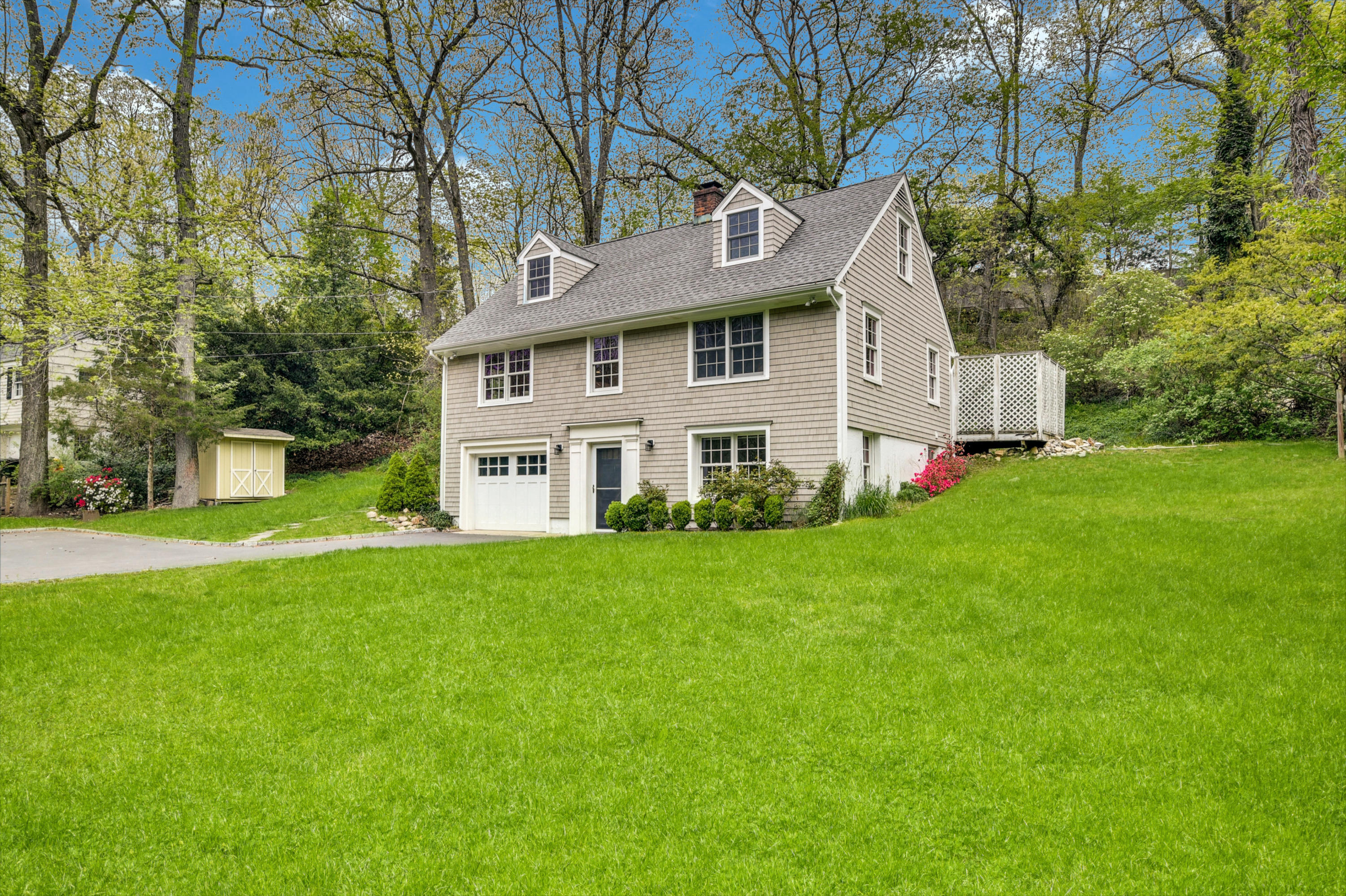 212 Tokeneke Road Darien, CT 06820 - Photo 20 of 23 a view of a house with a big yard plants and large trees
