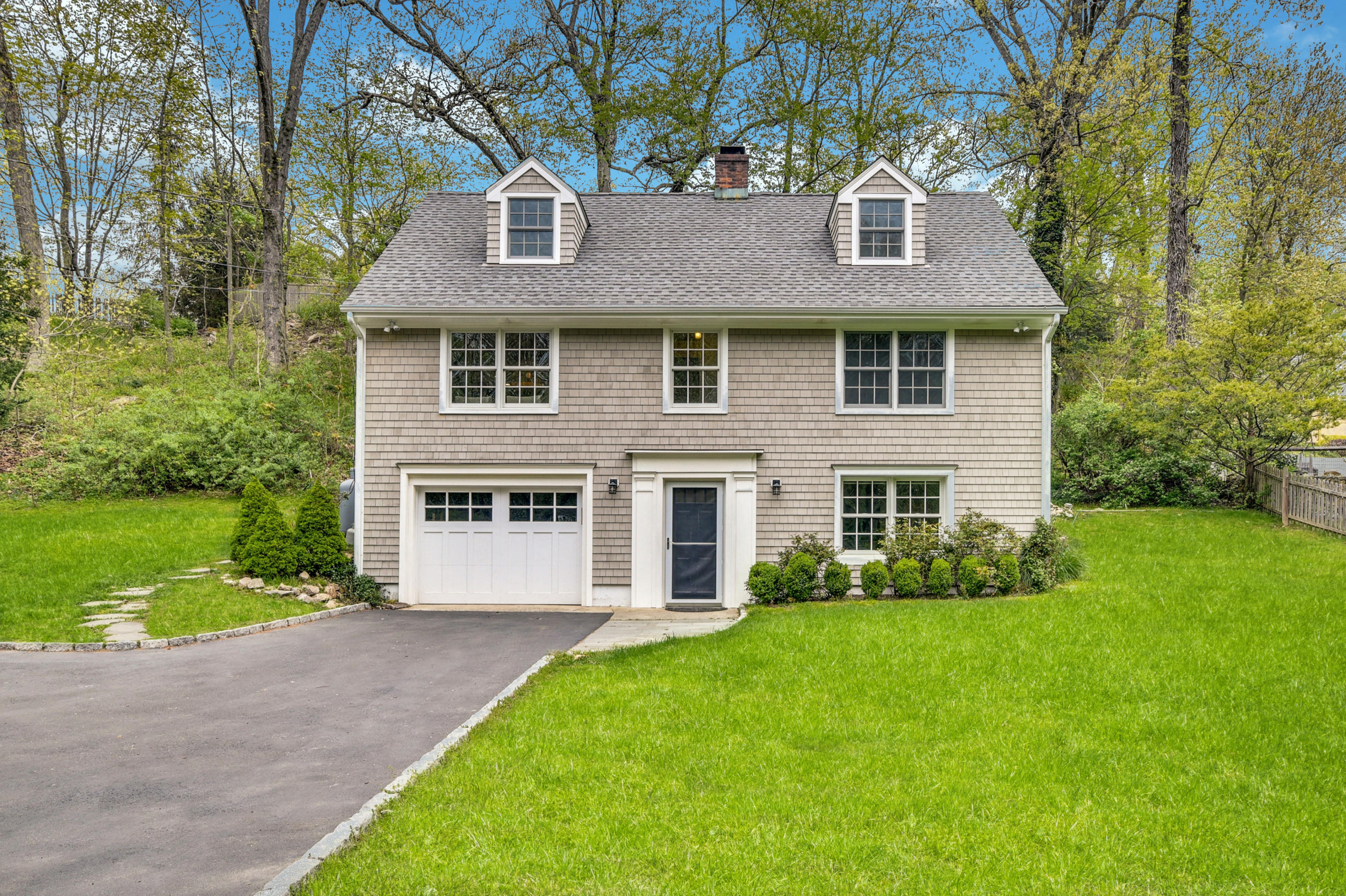 212 Tokeneke Road Darien, CT 06820 - Photo 2 of 23 a front view of a house with a yard