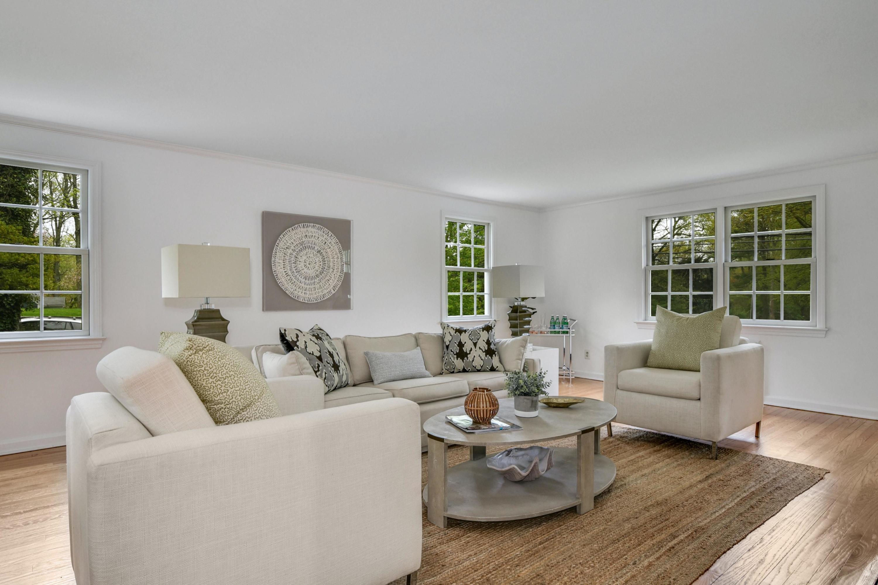 212 Tokeneke Road Darien, CT 06820 - Photo 3 of 23 a living room with furniture and a large window