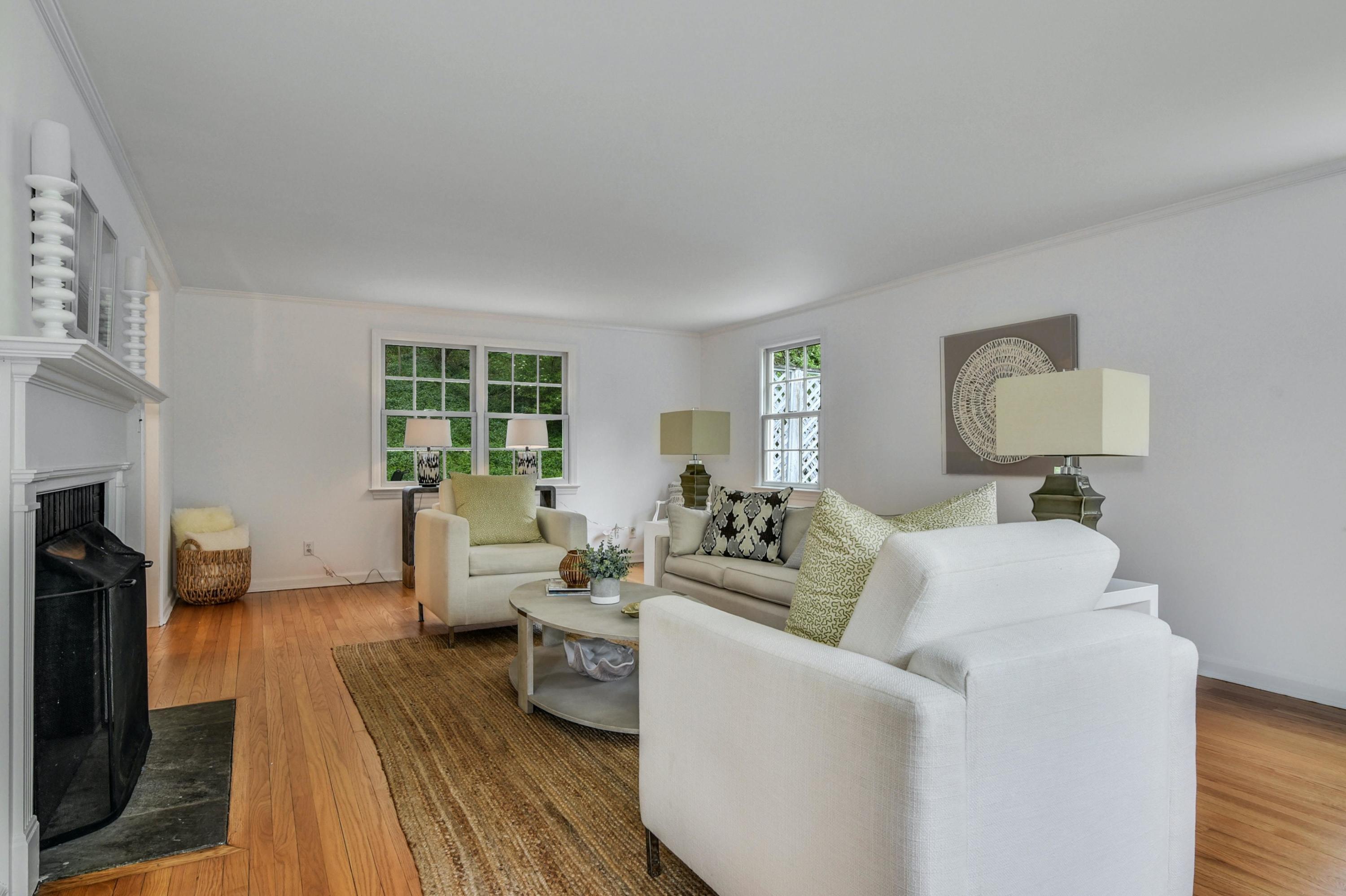 212 Tokeneke Road Darien, CT 06820 - Photo 5 of 23 a living room with furniture and a fireplace
