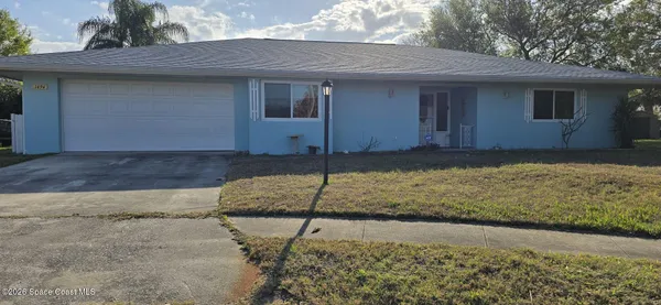 a house view with a backyard space
