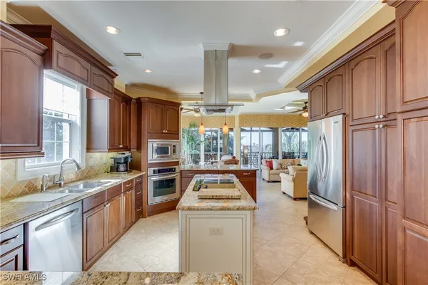 a kitchen with stainless steel appliances granite countertop a stove and a sink