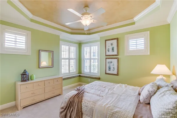 a bedroom with a bed dresser and a window