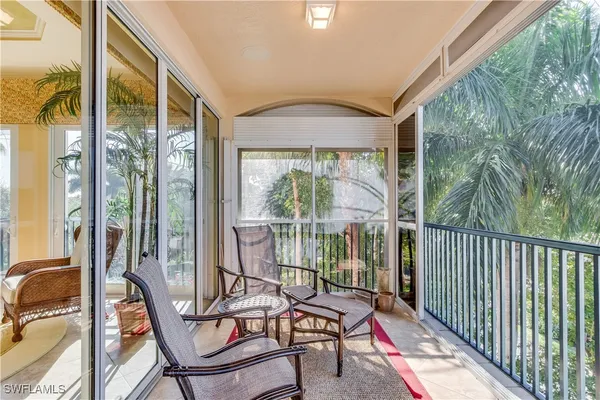 a view of a balcony with furniture