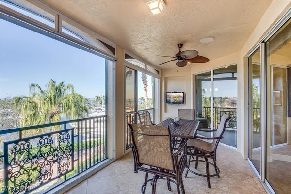 a view of a dining room with furniture window and outside view