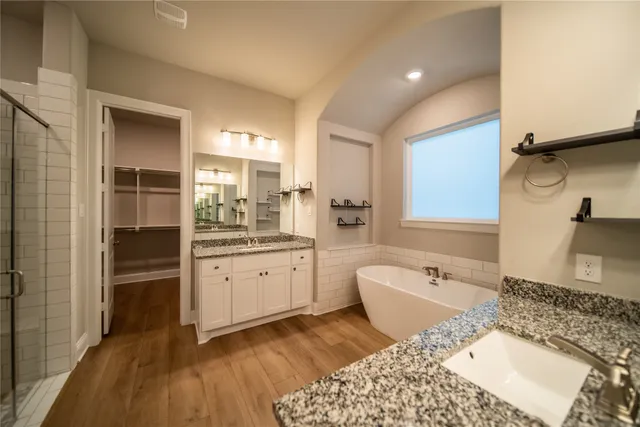a bathroom with a bathtub and a sink