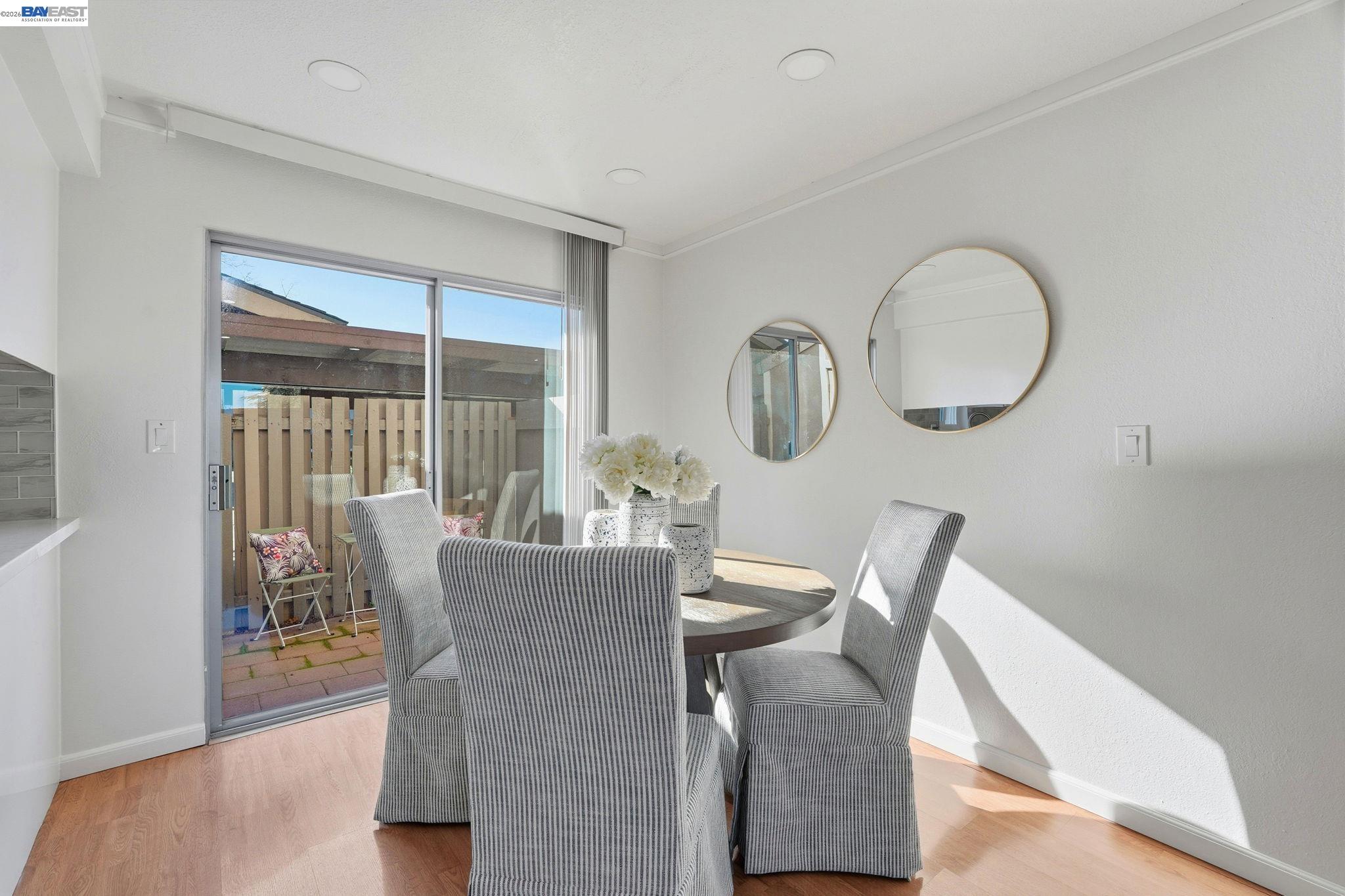 21091 Red Fir Court Cupertino, CA 95014 - Photo 11 of 39 a view of a dining room with furniture window and wooden floor