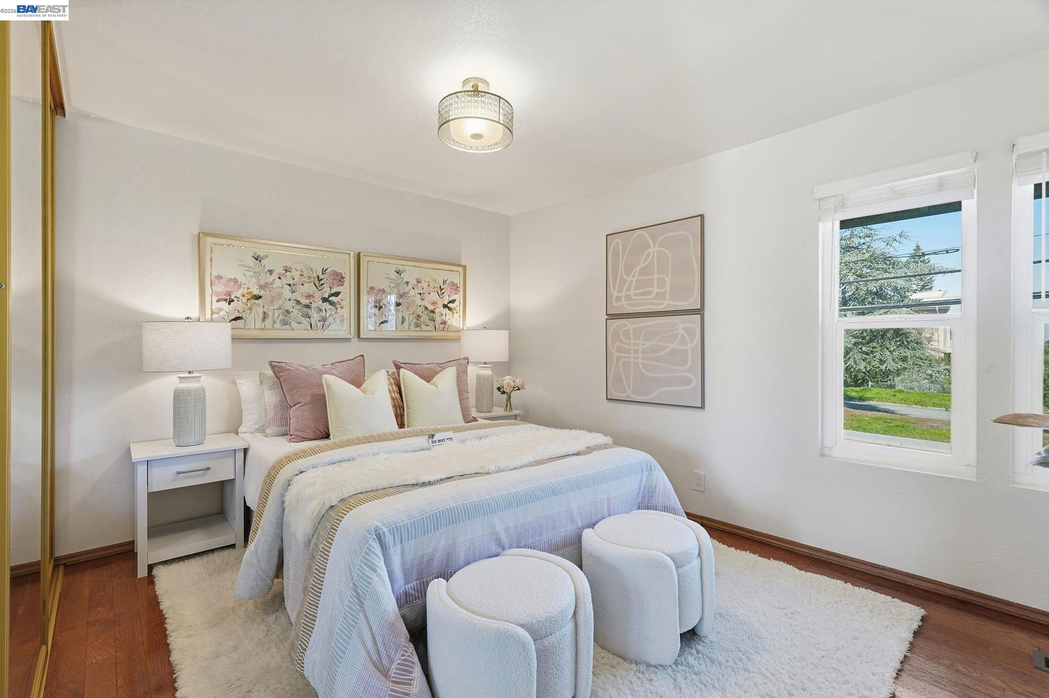 21091 Red Fir Court Cupertino, CA 95014 - Photo 12 of 39 a bedroom with a bed and a window