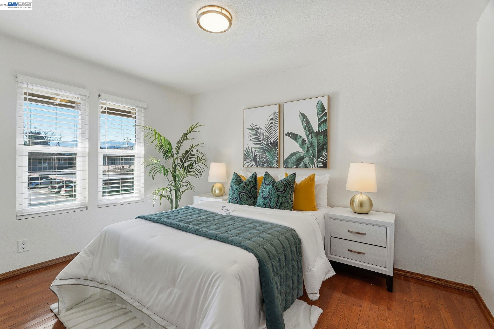 21091 Red Fir Court Cupertino, CA 95014 - Photo 16 of 39 a bedroom with a bed and wooden floor
