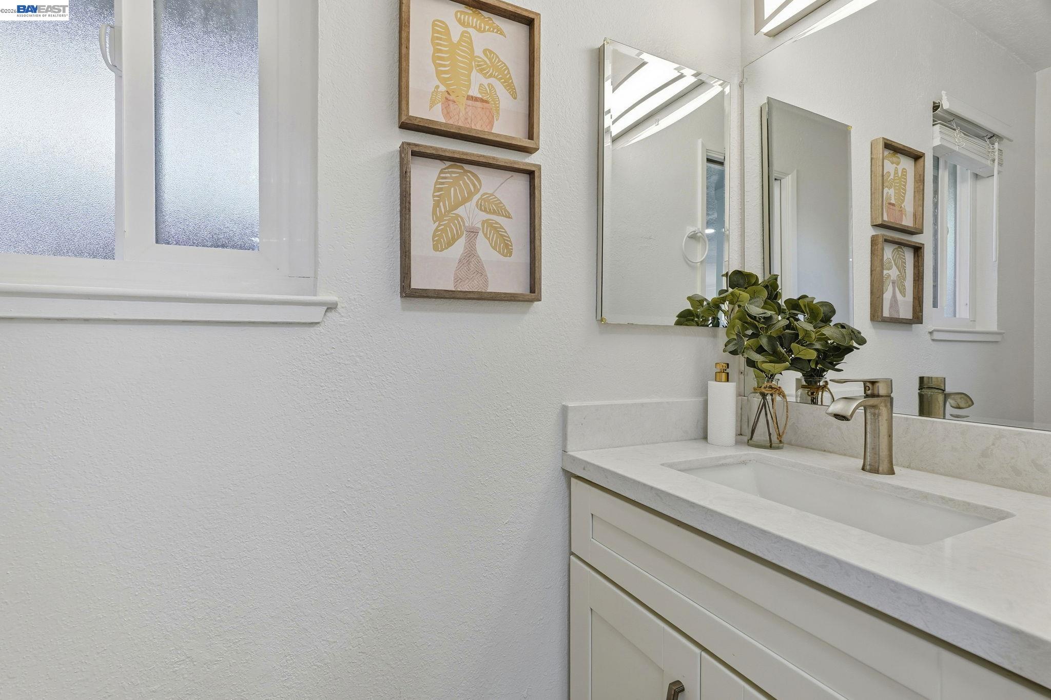 21091 Red Fir Court Cupertino, CA 95014 - Photo 10 of 39 a bathroom with a sink and a mirror