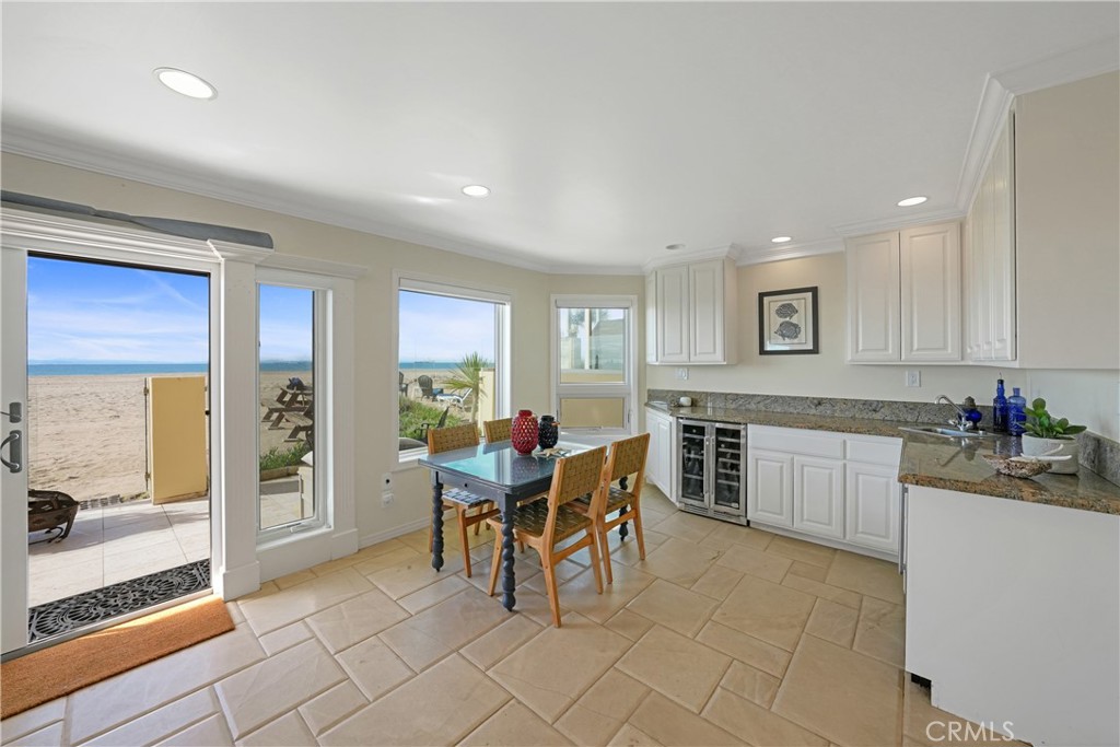 72-B Surfside Avenue Surfside, CA 90743 - Photo 17 of 56 a living room with furniture a dining table and chairs