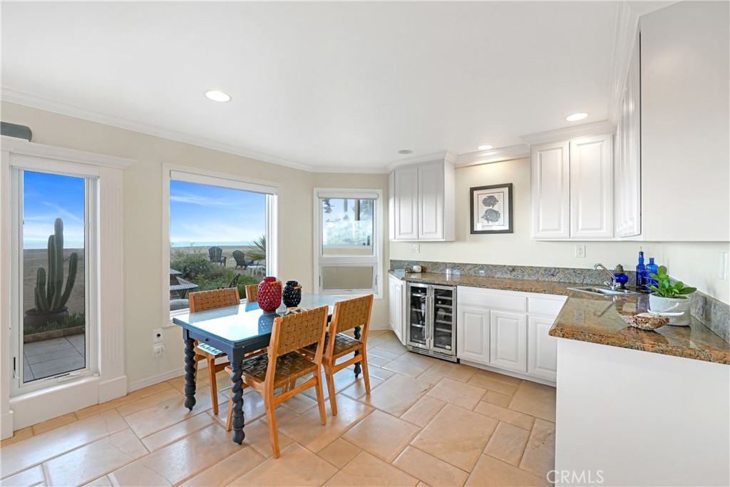 72-B Surfside Avenue Surfside, CA 90743 - Photo 18 of 56 a view of a dining room with furniture and window