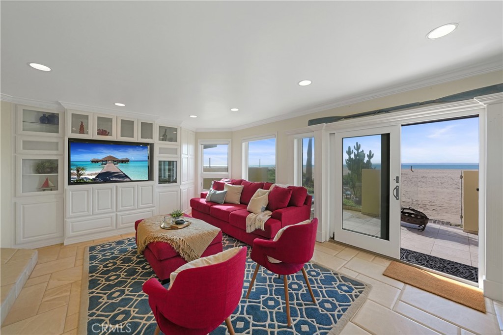 72-B Surfside Avenue Surfside, CA 90743 - Photo 20 of 56 a living room with furniture and a floor to ceiling window